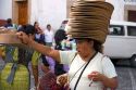 Mexican street vendor selling hats in the plaza at Taxco in the State of Guerrero, Mexico.