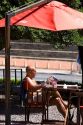 Man sitting at a outdoor cafe reading a magazine in Buenos Aires, Argentina.