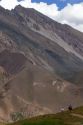 People hike on a trail in the Andes Mountain Range, Argentina.