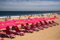 Umbrellas and beach chairs on the beach at Renaca on the Pacific Ocean in Chile.