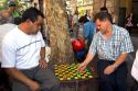 Chilean men play checkers in the Plaza de Armas in Santiago, Chile.