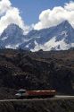 Truck driving on switchback roads through the Andes Mountain Range in Chile.