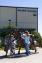 Children play around the Blue Bell Cow and Girl sculpture in front of the Blue Bell Creamery in Brenham, Texas.