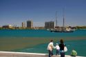 People walk along the St. Clair River at Port Huron, Michigan.