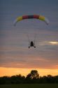 Powered parachute flying at sunset in Eaton County, Michigan.