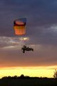 Powered parachute flying at sunset in Eaton County, Michigan.
