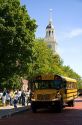School bus parked in front of the Independence Hall replica at The Henry Ford Museum in Dearborn, Michigan.