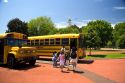 Children board a school bus at The Henry Ford in Dearborn, Michigan.