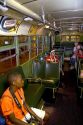 Black boy sits in Rosa Parks city bus seat on display at The Henry Ford Museum in Dearborn, Michigan.