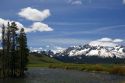 The Salmon River flowing through the Sawtooth Valley below the Sawtooth Mountain Range near Stanley, Idaho.