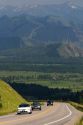 Vehicles travel over the high mountain Teton Pass on Wyoming Highway 22 near the state border of Wyoming and Idaho.