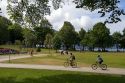 Bicyclists ride along the Seawall path in Stanley Park at Vancouver, British Columbia, Canada.