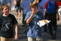 Boy eating fair food at the Western Idaho Fair in Boise, Idaho.