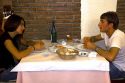 Young couple dining at a restaurant in the city of Donostia-San Sebastian, Guipuzcoa, Basque Country, Northern Spain.