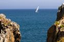 Sailboat entering the harbor at Castro Urdiales, Cantabria, northern Spain.