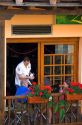 People dine on the balcony of a restaurant in the town of Potes, Liebana, Cantabria, northwestern Spain.