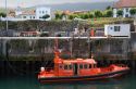 Maritime rescue vessel in the harbor at Llanes, Asturias, Spain.