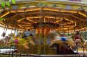 Merry-go-round in motion in the market town of Stratford-upon-Avon, Warwickshire, England.
