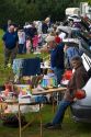 People buy and sell household items at a car boot sale in the market town of Banbury, Oxfordshire, England.