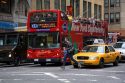 Tourists ride on a double decker bus sightseeing tour in Manhattan, New York City, New York, USA.