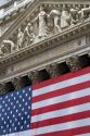 American flag hangs in front of the New York Stock Exchange in New York City, New York, USA.