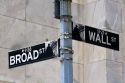 Street sign for Wall and Broad in New York City, New York, USA.