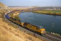 Union Pacific intermodal container train traveling along the Snake River in Elmore County, Idaho, USA.