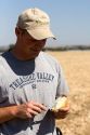 Farmer checks for the moisture content of harvested onions in Canyon County, Idaho, USA. MR