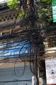 A tangle of telephone wires on a utility pole in Ho Chi Minh City, Vietnam.