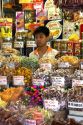 Young Vietnamese boy selling treats in the Ben Thanh Market located in Ho Chi Minh City, Vietnam.