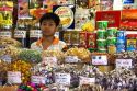 Young Vietnamese boy selling treats in the Ben Thanh Market located in Ho Chi Minh City, Vietnam.