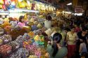 Vendors selling treats in the Ben Thanh Market located in Ho Chi Minh City, Vietnam.