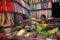 Vendors selling silk fabric in the Ben Thanh Market located in Ho Chi Minh City, Vietnam.