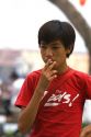 Young Vietnamese teen smoking a cigarette in Ho Chi Minh City, Vietnam.