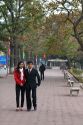 Couple walking along the Hoan Kiem Lake in Hanoi, Vietnam.