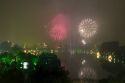 Firework display over a smoky Hoan Kiem Lake for Tet festivities in Hanoi, Vietnam.
