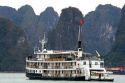 Scenic views of limestone isles and boats in Ha Long Bay, Vietnam.