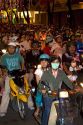 Vietnamese people ride motorbikes on Dong Khoi street during the last night of Tet Lunar New Year celebrations in Ho Chi Minh City, Vietnam.