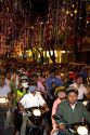 Vietnamese people ride motorbikes on Dong Khoi street during the last night of Tet Lunar New Year celebrations in Ho Chi Minh City, Vietnam.