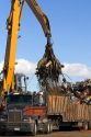 Hydraulic grapple lifting scrap steel for recycling at the Pacific Steel and Recycling center in Elmore County, Idaho.
