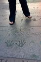Celebrity handprints, footprints, and autograph in the concrete of the Grauman's Chinese Theatre located in Hollywood, Los Angeles, California, USA.