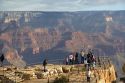 Tourists view the South Rim of the Grand Canyon, Arizona, USA.
