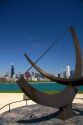 Cast bronze sundial sculpture named Man Enters the Cosmos by artist Henry Moore located on Lake Michigan outside the Adler Planetarium in Chicago, Illinois, USA.