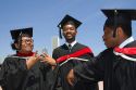 Multi ethnic college graduates celebrate the occasion in Grant Park, Chicago, Illinois, USA.