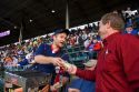 Vendor selling hot dogs during a Cubs baseball game at Wrigley Field in Chicago, Illinois, USA.