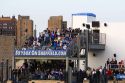 Fans watch a Cubs baseball game from a luxury skybox at Wrigley Field in Chicago, Illinois, USA.