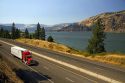 Truck transporting freight through the Columbia River Gorge near Hood River, Oregon, USA.