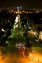 Night view of the Avenue des Champs-Elysees looking toward the Arche de la Defense located in Paris, France.
