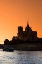Nortre Dame cathedral and the River Seine at sunset in Paris, France.