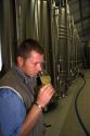Winemaker testing the fermentation process of Champagne at the M. Hostomme winery in Chouilly, northeast France.
